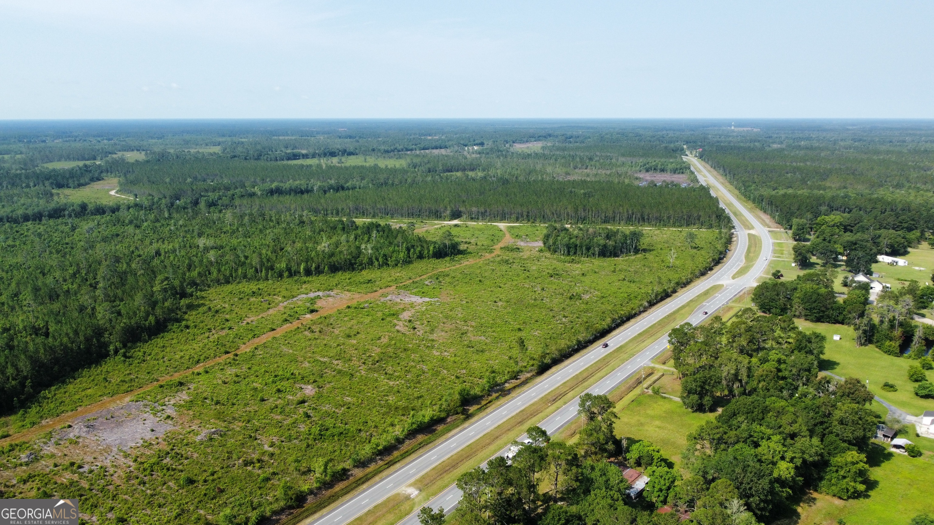 0 Highway 84, Unit 4 Homerville, GA 31634 - Photo 2 of 8 a view of a city with lush green forest