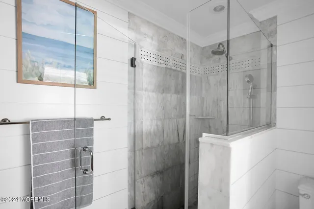 a kitchen with a stove and white cabinets