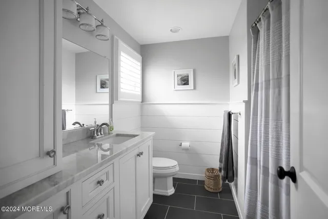 a bedroom with a bed and a cabinets