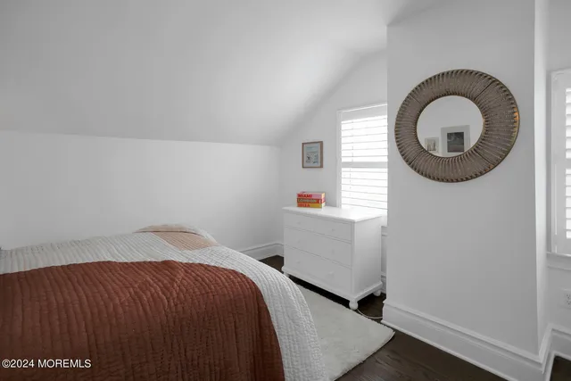 a bathroom with a sink vanity and a mirror