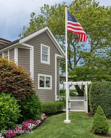 a front view of house with yard outdoor seating and barbeque oven