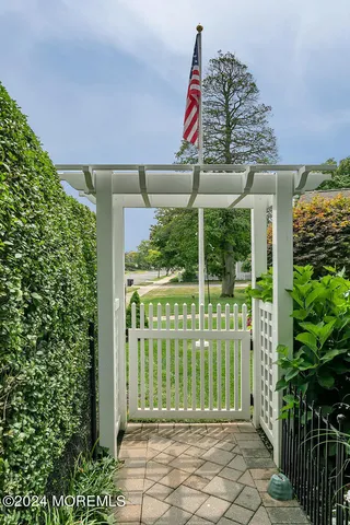 a view of a patio with table and chairs and potted plants