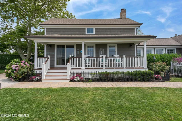 a view of a chairs and table in the backyard