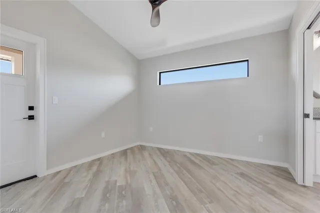 a view of a room with wooden floor