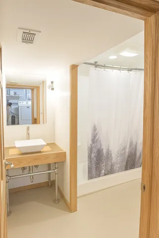 a bathroom with a tub and shower