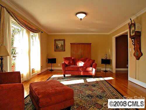 4727 Gaynor Road Charlotte, NC 28211 - Photo 2 of 8 a living room with furniture a rug and a large window
