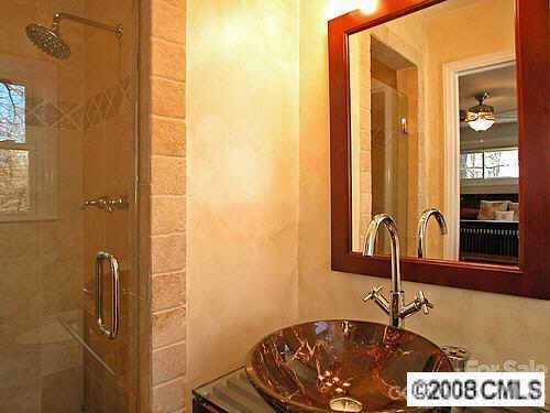 4727 Gaynor Road Charlotte, NC 28211 - Photo 6 of 8 a bathroom with a sink and a mirror