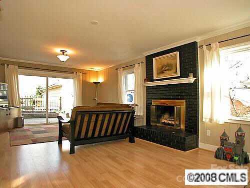 4727 Gaynor Road Charlotte, NC 28211 - Photo 7 of 8 a living room with furniture and a fireplace