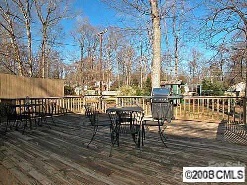 4727 Gaynor Road Charlotte, NC 28211 - Photo 8 of 8 a view of a deck with two chairs and wooden floor