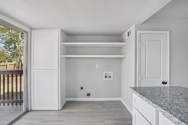 a bathroom with a granite countertop toilet sink and mirror