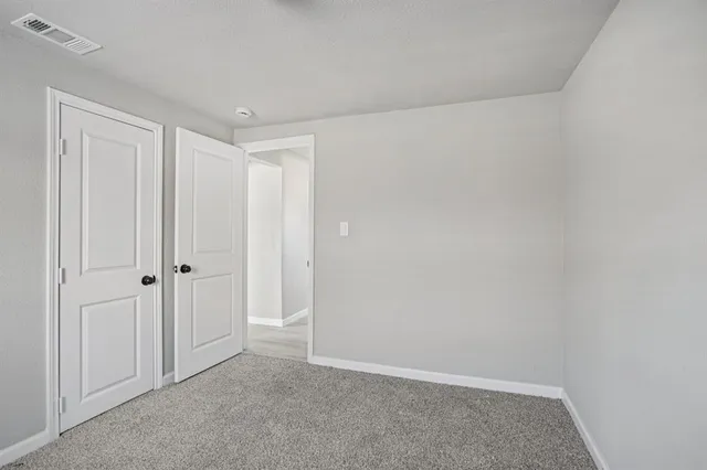 a view of a chandelier fan in a room