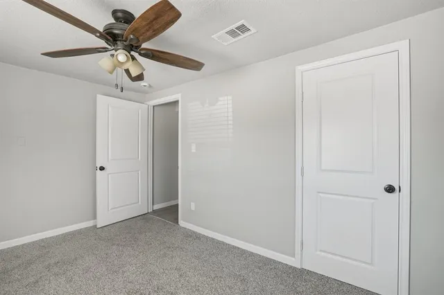 a view of a deck with wooden floor and fence