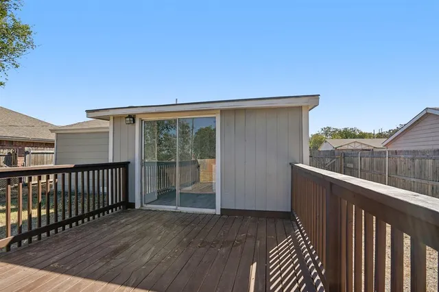 a view of a backyard with a large tree