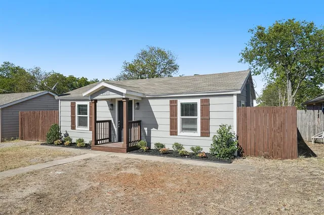 front view of a house with a yard