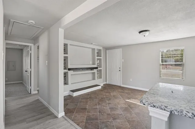 a view of a kitchen with microwave and stove