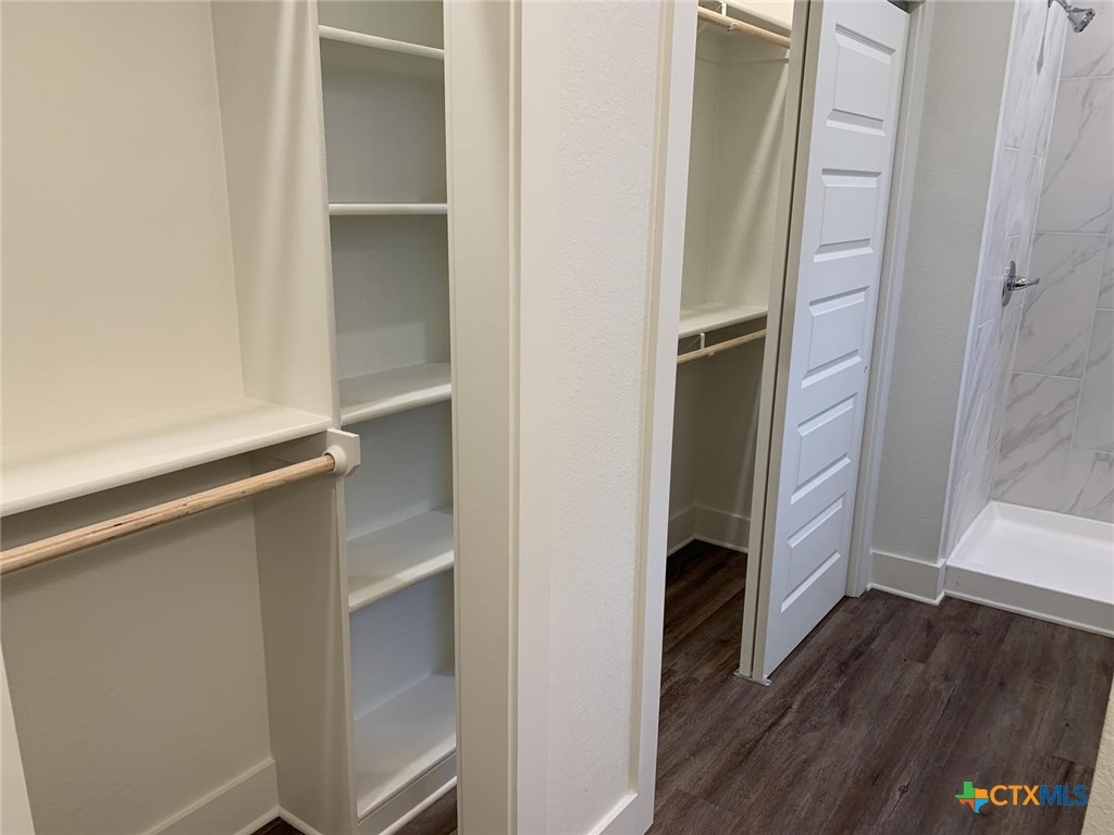 1862 Royal Loop Belton, TX 76513 - Photo 16 of 26 a walk in closet with wooden floor