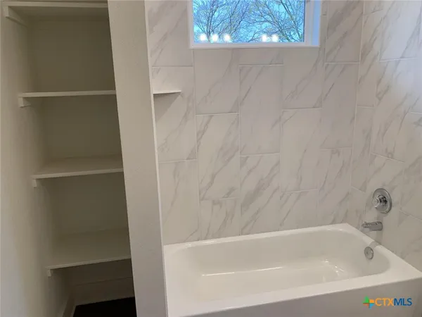 a bathroom with a bathtub