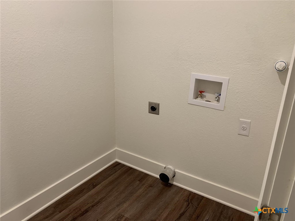 1862 Royal Loop Belton, TX 76513 - Photo 26 of 26 a room with a wooden floor and white walls