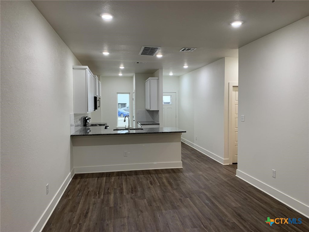 1862 Royal Loop Belton, TX 76513 - Photo 8 of 26 a view of room with wooden floor