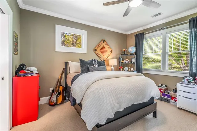 a bathroom with a sink a toilet and shower curtain