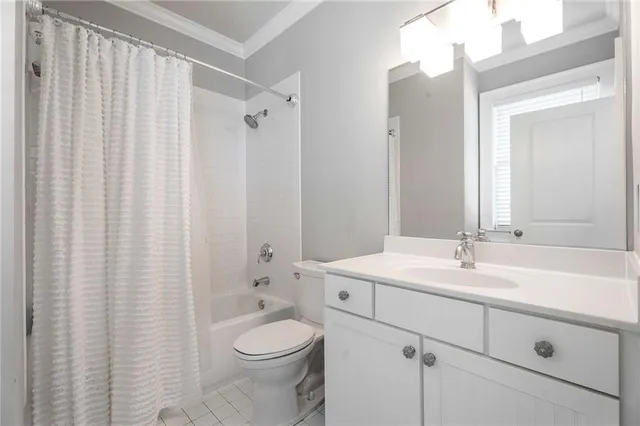 a view of a patio with couches table and chairs and potted plants