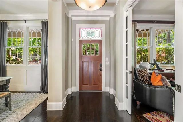 a view of a dining room with furniture window and wooden floor