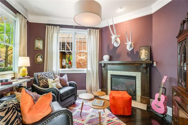 a dining room with furniture and window