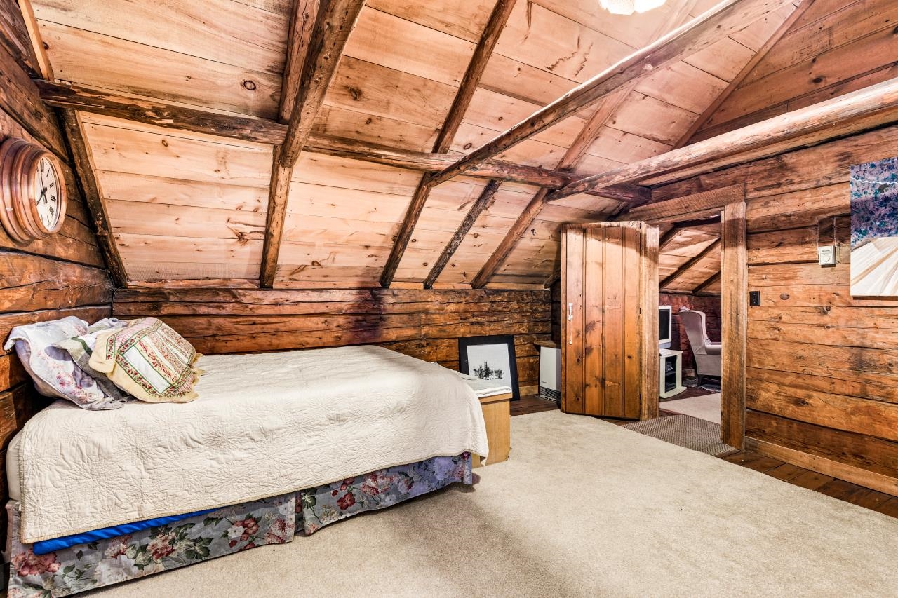 3723 Birchwood Road Kettle River, MN 55757 - Photo 32 of 48 Bedroom featuring wooden ceiling, carpet, and wooden walls