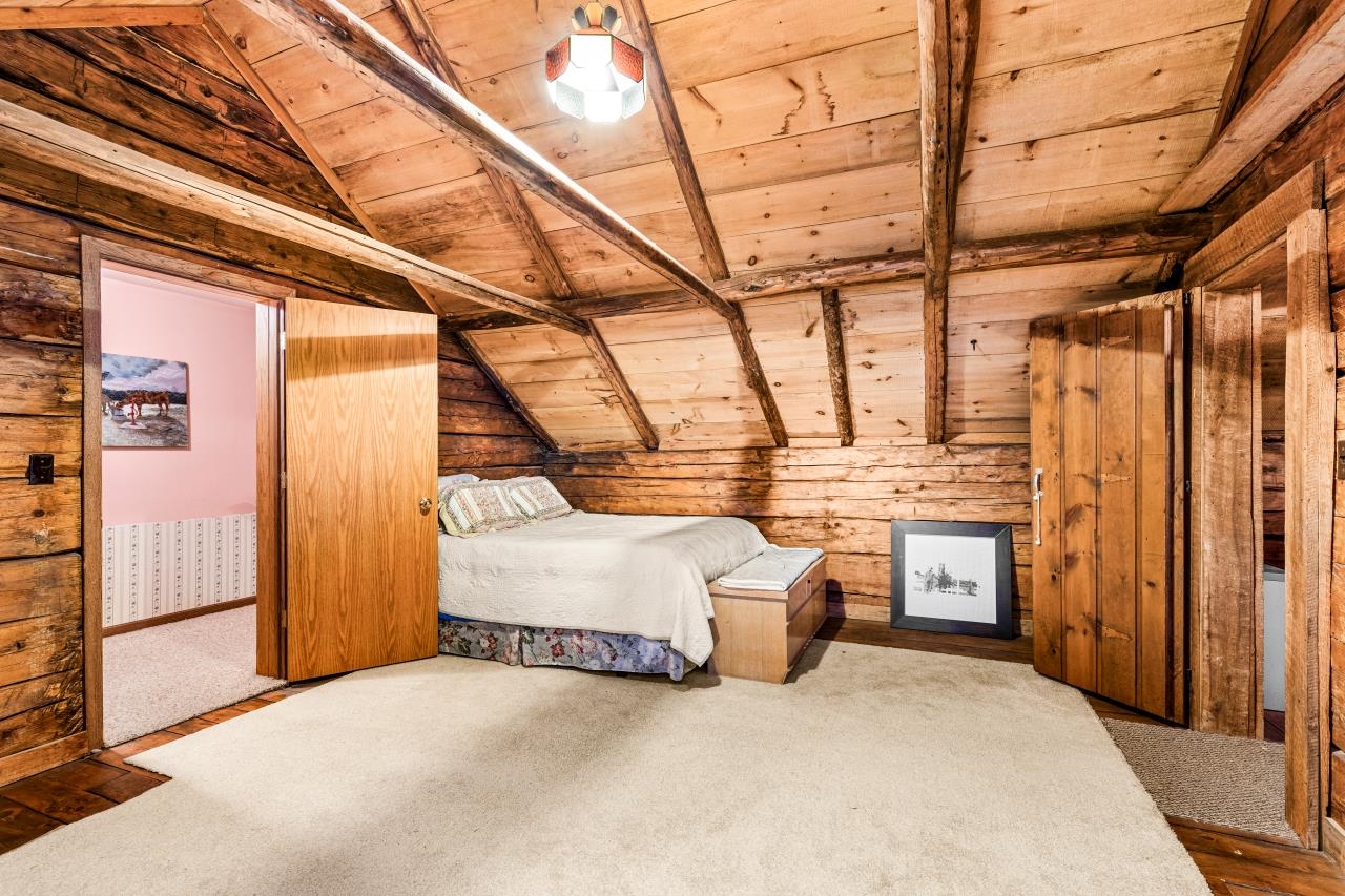 3723 Birchwood Road Kettle River, MN 55757 - Photo 33 of 48 Bedroom with wood ceiling, carpet flooring, and wooden walls