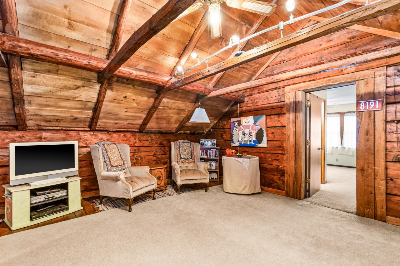 3723 Birchwood Road Kettle River, MN 55757 - Photo 39 of 48 Living area featuring carpet, wood ceiling, and wood walls