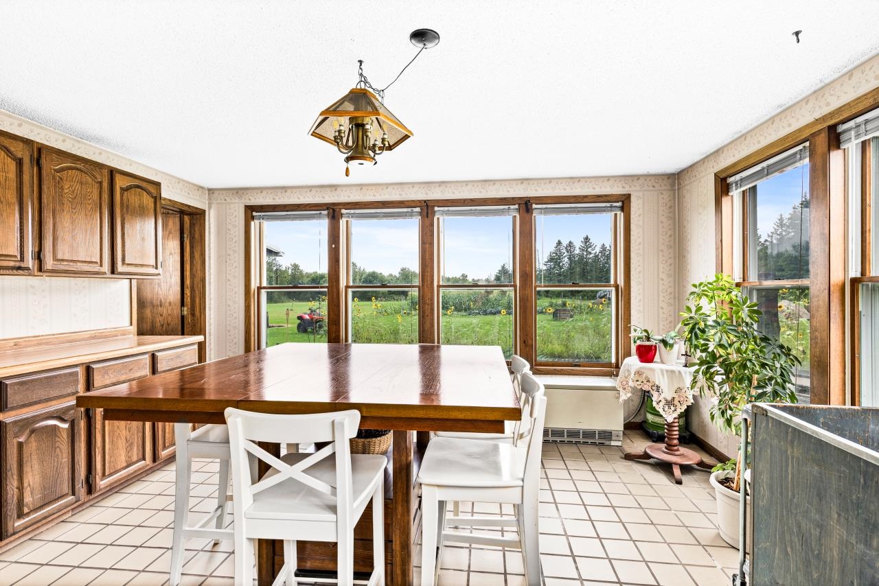 3723 Birchwood Road Kettle River, MN 55757 - Photo 9 of 48 Dining room featuring light tile patterned floors and wallpapered walls