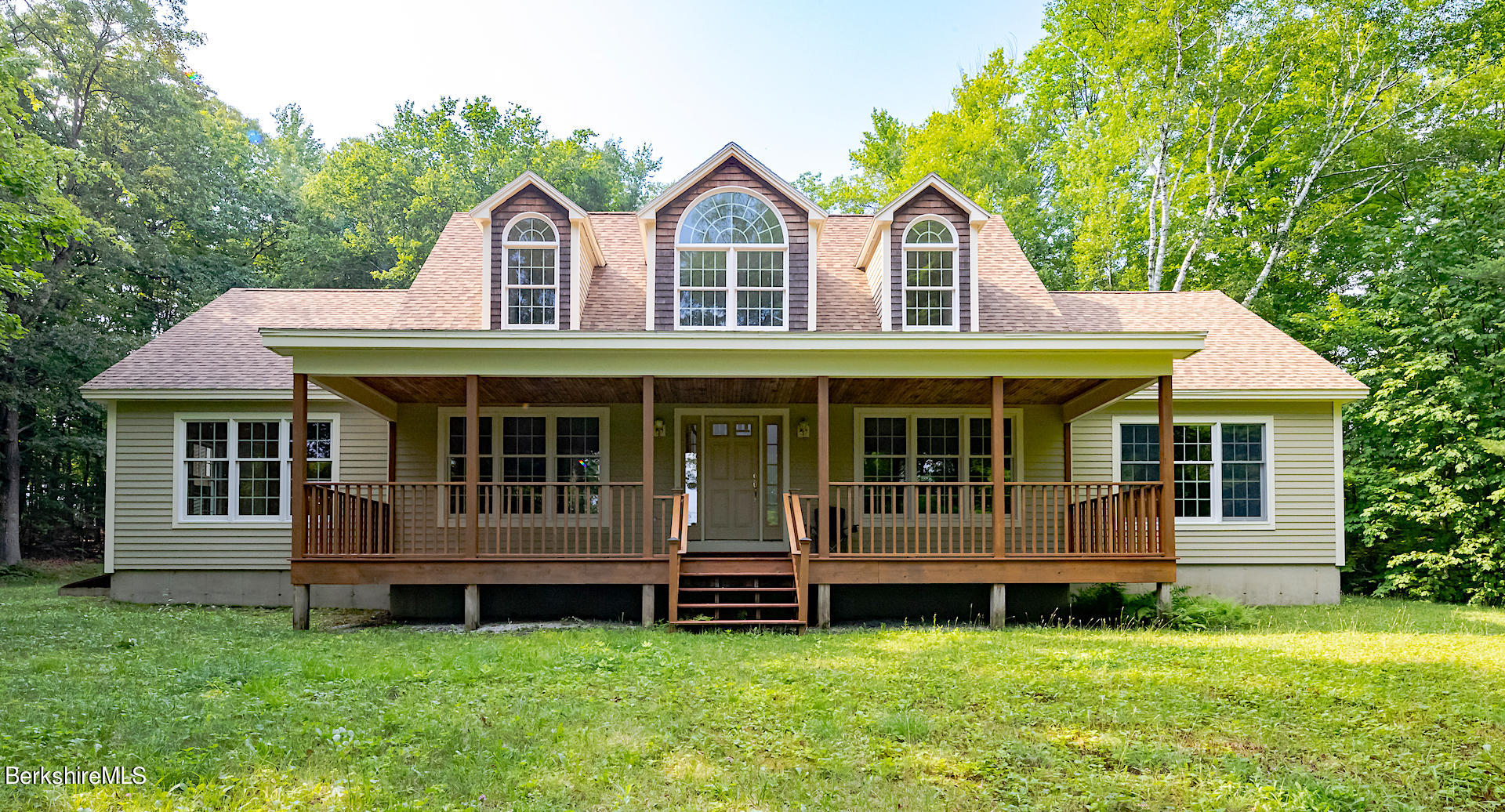 6 Oxbow Road Egremont, MA 01230 - Photo 2 of 42 a front view of a house with a garden