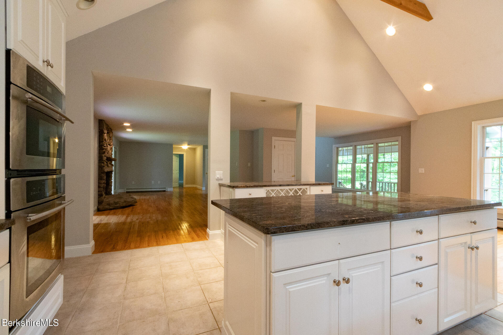 6 Oxbow Road Egremont, MA 01230 - Photo 11 of 42 a kitchen with a granite countertop sink and white cabinets