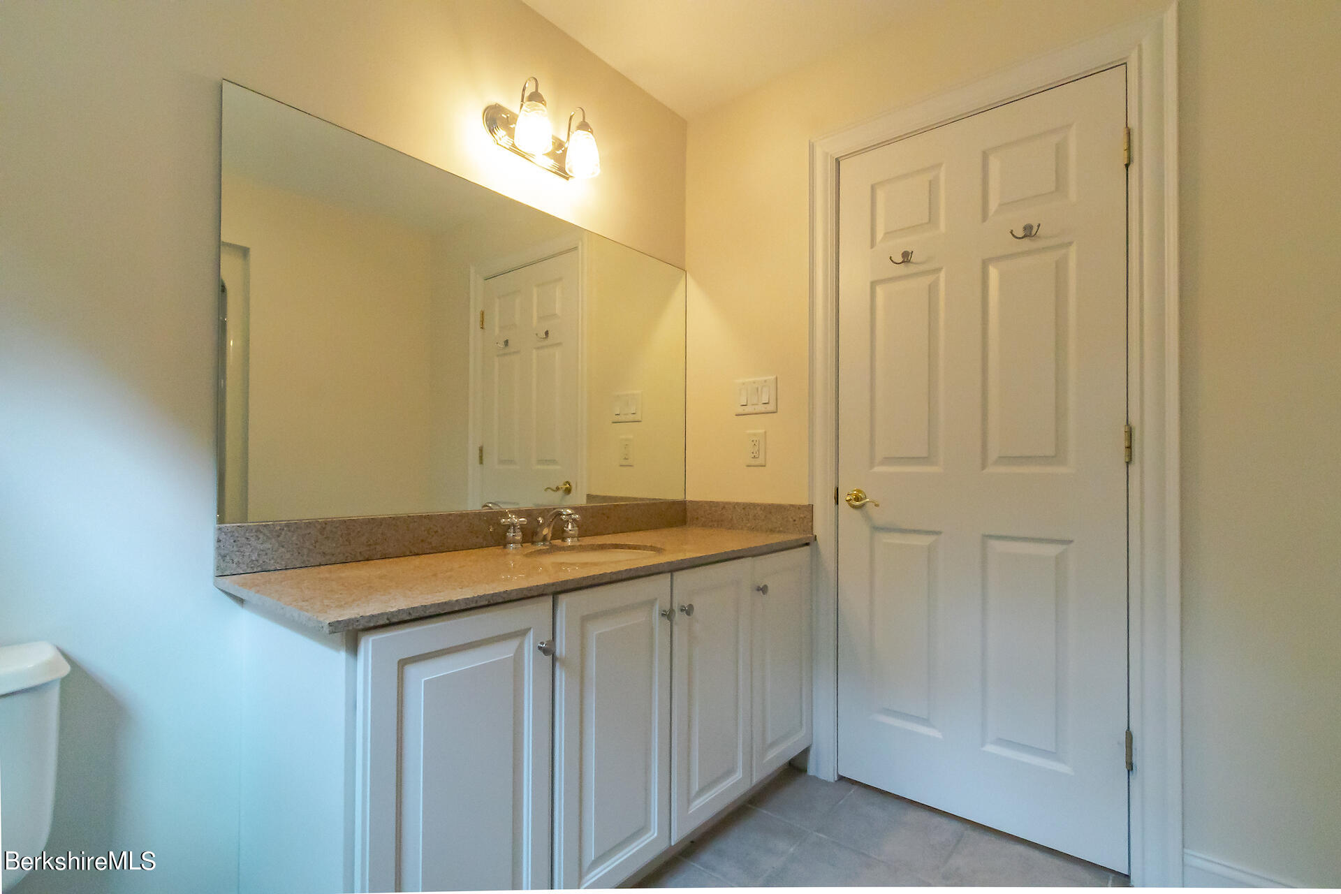 6 Oxbow Road Egremont, MA 01230 - Photo 30 of 42 a bathroom with a granite countertop sink and a mirror