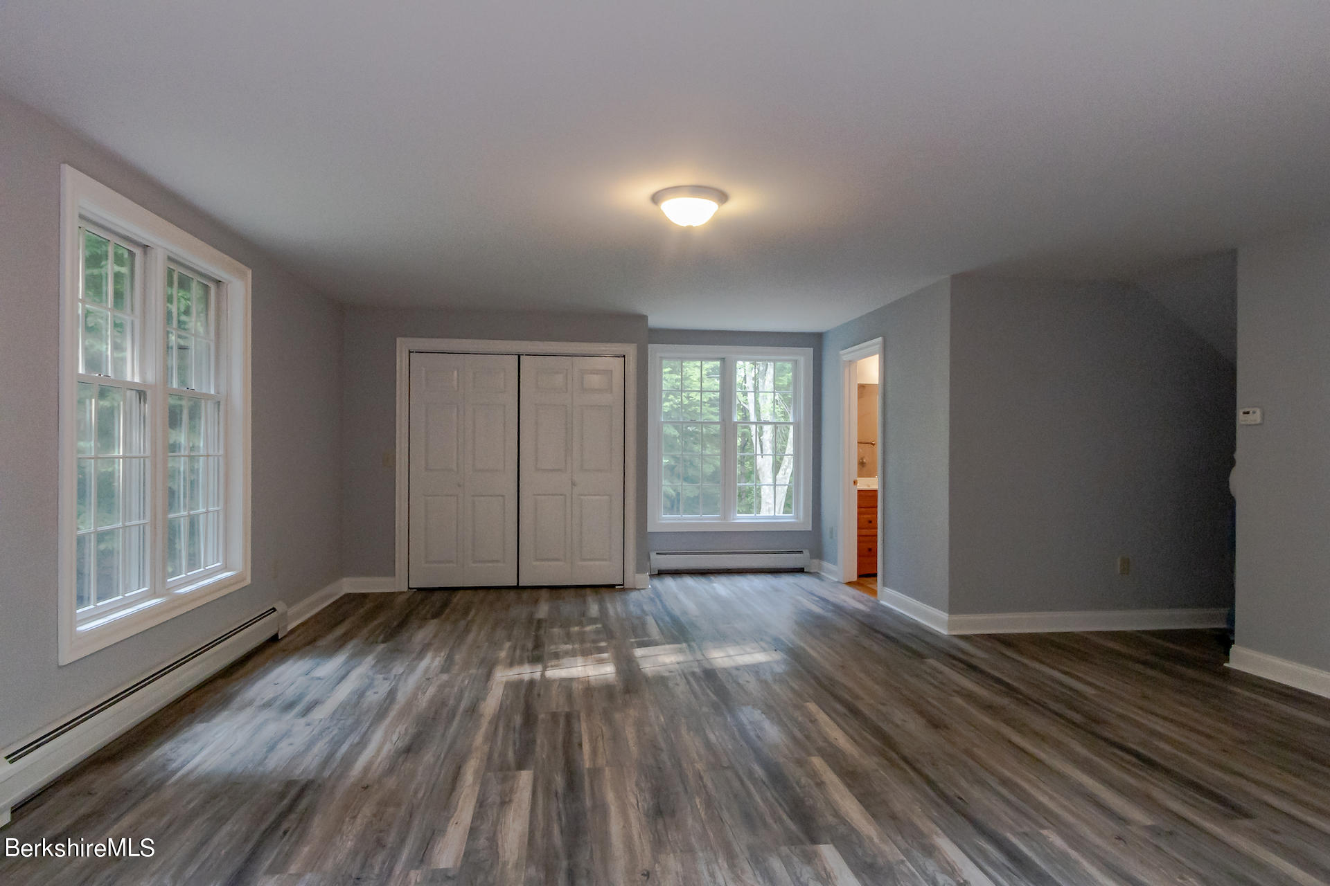 6 Oxbow Road Egremont, MA 01230 - Photo 34 of 42 a view of an empty room with wooden floor and a window