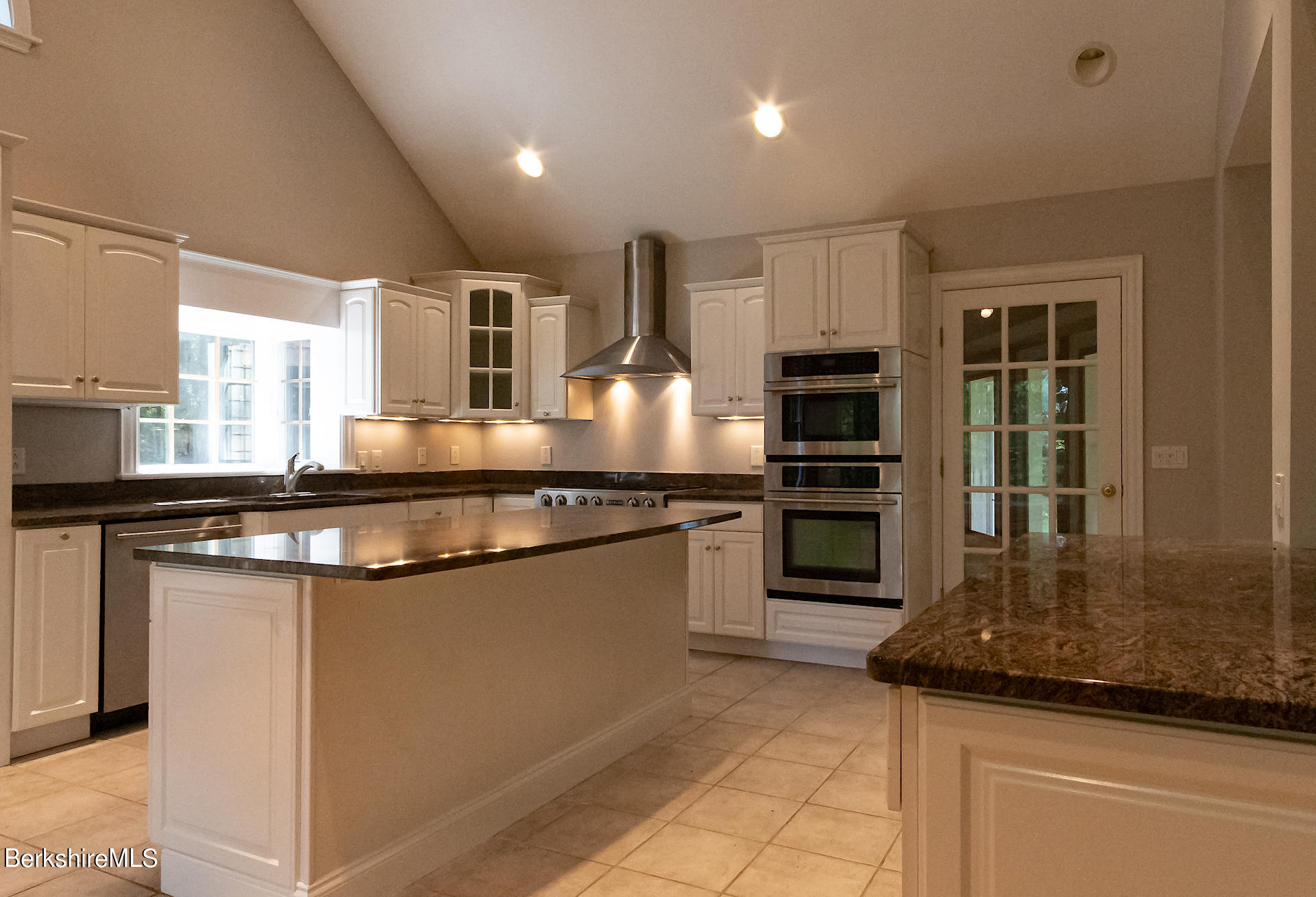 6 Oxbow Road Egremont, MA 01230 - Photo 8 of 42 a kitchen with kitchen island granite countertop a stove and a sink