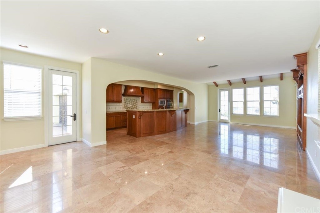 19 Ferrand Newport Coast, CA 92657 - Photo 17 of 74 wooden floor in an empty room with a window and a kitchen