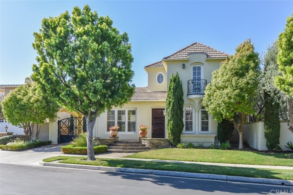 19 Ferrand Newport Coast, CA 92657 - Photo 2 of 74 a front view of a house with a yard