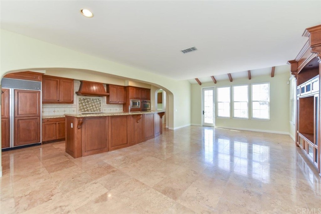 19 Ferrand Newport Coast, CA 92657 - Photo 24 of 74 a kitchen with stainless steel appliances granite countertop a stove a sink and a refrigerator