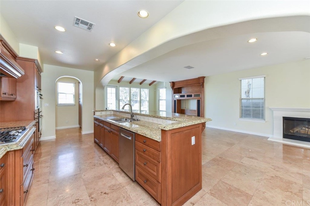 19 Ferrand Newport Coast, CA 92657 - Photo 25 of 74 a large kitchen with stainless steel appliances granite countertop a large counter top and a stove