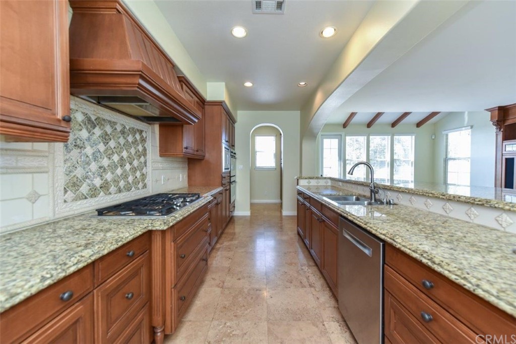19 Ferrand Newport Coast, CA 92657 - Photo 26 of 74 a large kitchen with stainless steel appliances granite countertop a lot of counter space and a sink