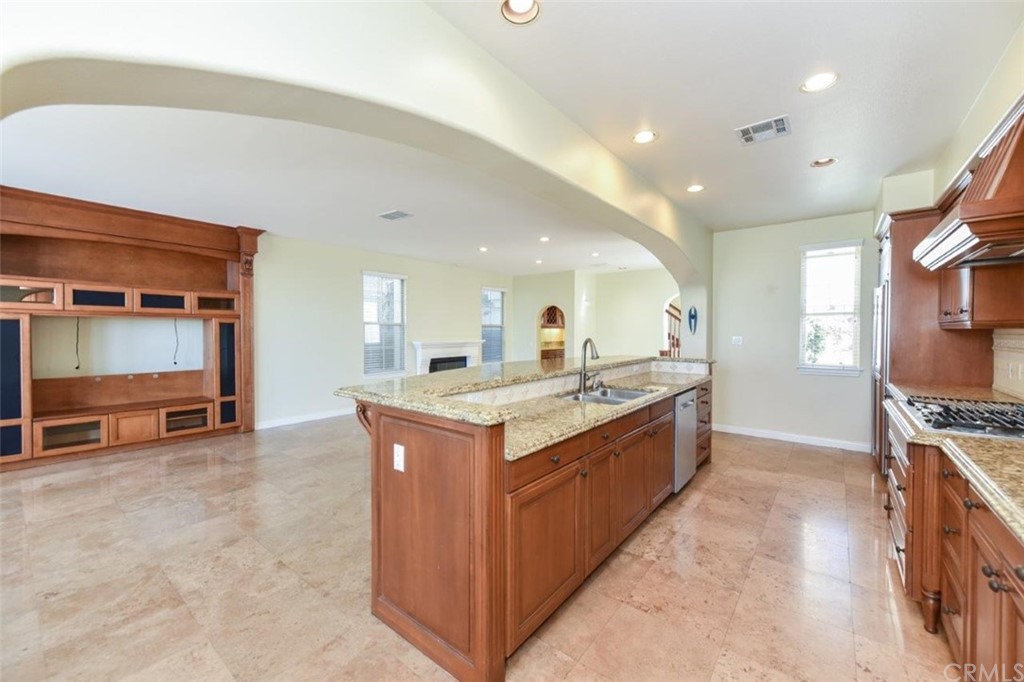 19 Ferrand Newport Coast, CA 92657 - Photo 27 of 74 a large kitchen with stainless steel appliances granite countertop a large counter top and a stove