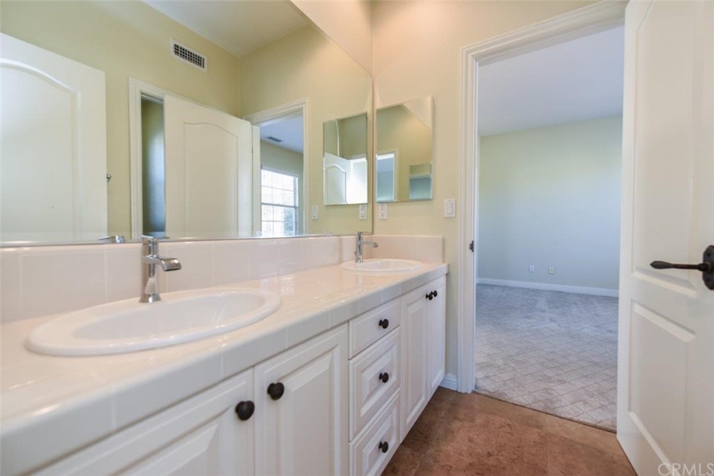 19 Ferrand Newport Coast, CA 92657 - Photo 44 of 74 a bathroom with a sink and a mirror