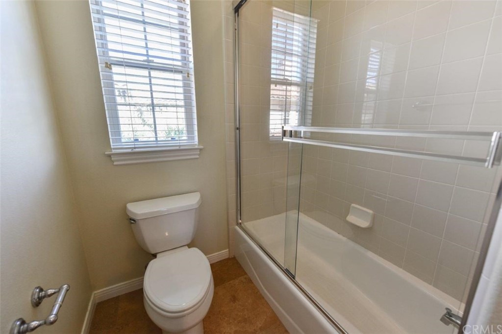 19 Ferrand Newport Coast, CA 92657 - Photo 45 of 74 a white toilet sitting next to a bath tub