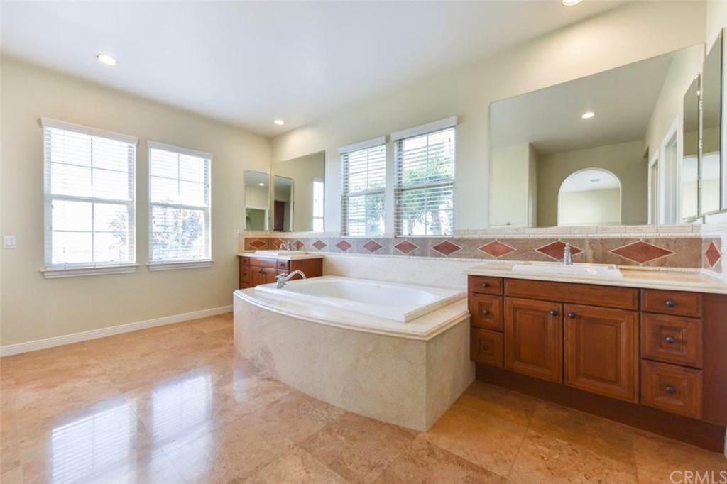 19 Ferrand Newport Coast, CA 92657 - Photo 49 of 74 a spacious bathroom with a sink double vanity and a large mirror