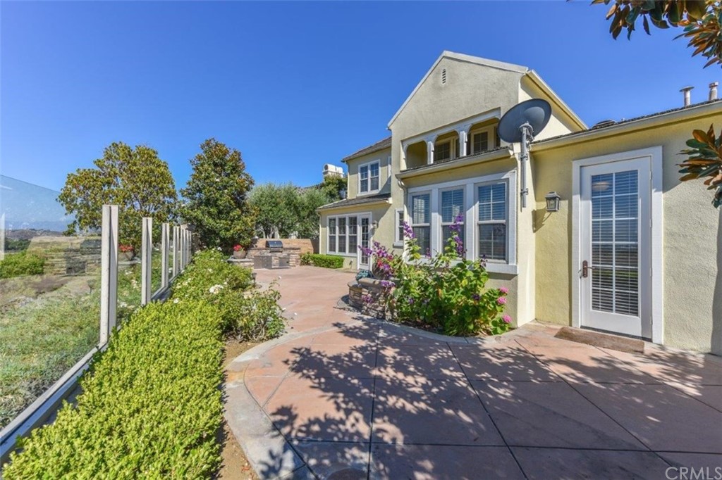 19 Ferrand Newport Coast, CA 92657 - Photo 69 of 74 a front view of a house with a yard