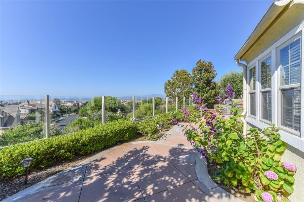 19 Ferrand Newport Coast, CA 92657 - Photo 70 of 74 a view of a garden with a building in the background
