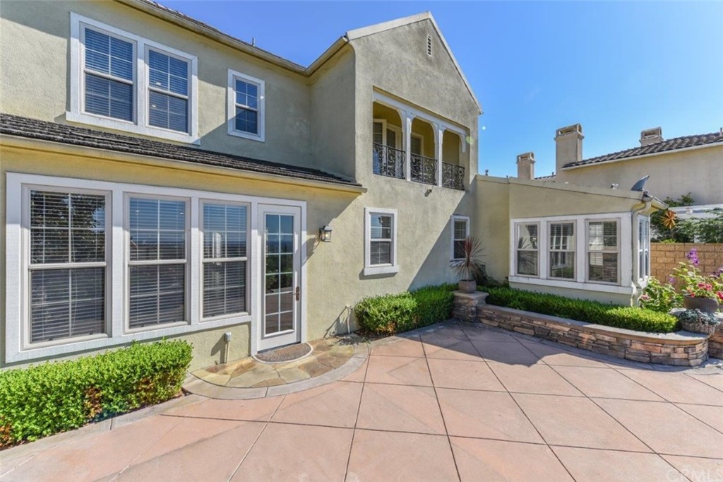 19 Ferrand Newport Coast, CA 92657 - Photo 72 of 74 front view of a brick house with a large windows
