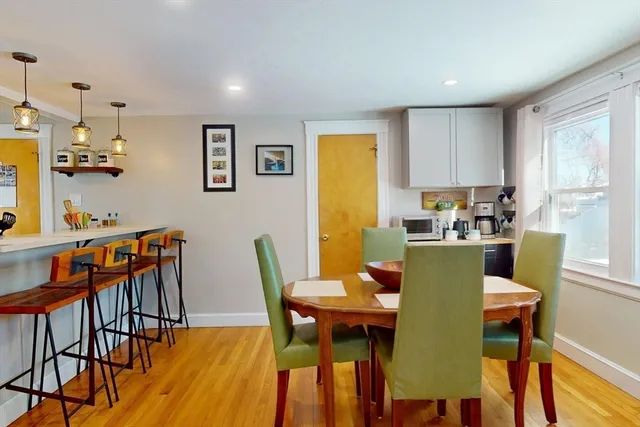 a dining room with furniture a window and kitchen view