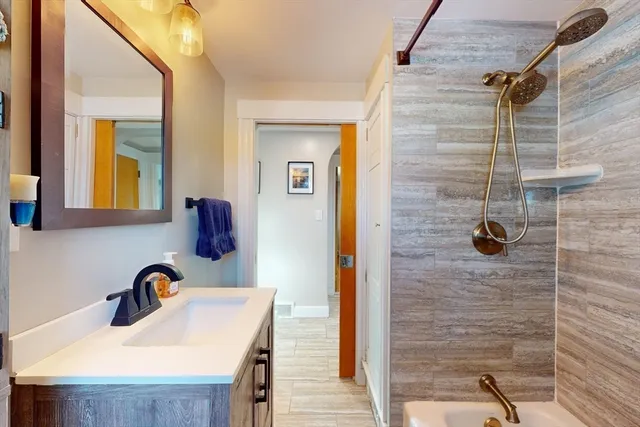 a bathroom with a sink and mirror